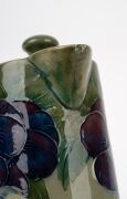 MOORCROFT rare and early "Pansy" pattern teapot and companion hot water pot on celadon green ground, (2 items), both impressed "MOORCROFT BURSLEM" with green signature "W. Moorcroft", ​​​​​​​15.5cm high. - 15