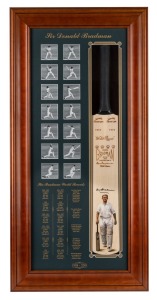 DON BRADMAN: 2001 framed and glazed display titled "Sir Donald Bradman", limited edition #241/260, comprising full-size Slazenger commemorative bat with Bradman's original signature in permanent marker and hand-painted portrait by Archibald finalist Dave Thomas, together with flicker-style series of fourteen images of Bradman at bat and detailed enumeration of his career statistics; 114 x 55cm overall, accompanied by 35.5 x 44cm framed and glazed CoA.