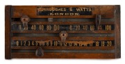 An early 20th century miniature wall-mounted billiards scoreboard by Burroughes & Watts, London; two hand-painted number tracks with original sliding score markers; missing right end piece; dimensions 9 x 19.5cm.