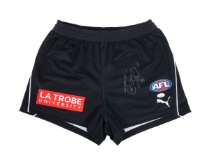 KADE SIMPSON - CARLTON 300 CLUB: A pair of Carlton AFL ON-Field Team Gear football shorts, signed by Kade Simpson with "342" the number of his appearances for the club written next to his signature. With two Certificates of Authenticity.