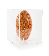 An artwork titled "Football Spirits" by Australian indigenous artist Kathleen Kemarre Wallace (1948 - 2024), comprising a football decorated with an intricate design in yellow, black, white, and gold; housed in bespoke perspex case measuring approx. 30 x - 3