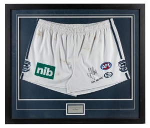 THE 2009 GRAND FINAL - GEELONG 12.8.80 defeated ST.KILDA 9.14.68 A match-worn pair of shorts, signed and endorsed by STEVE JOHNSON. Attractively framed & glazed. Overall 65 x 76cm.