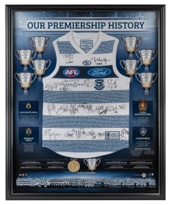 GEELONG CATS PREMIERSHIP HISTORY GUERNSEY - 2011 A superbly presented "150th Anniversary Guernsey" celebrating Geelong's nine premierships between 1925 and 2011; the original signatures of the 2009 Premiership team have been applied to the guernsey, which is surrounded by replica Carji Greeves, Brownlow, Norm Smith and Coleman medals, with details of the Geelong winners, images of the Premiership Cups and details of some of Geelong's greatest players