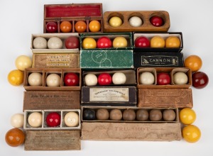 A collection of antique billiard balls, of which at least three ivory; the rest wooden, or early plastics like bonzoline or crystalate; most in original maker's boxes, the brands including "E.M. Co.", "John Taylor & Son", "Thurston & Co.", "Tru-Shot", and "Orme & Sons". (43 balls total)