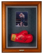 MIKE TYSON: A timber display case comprising a signed photograph and "Everlast" glove, with plaque at base engraved "Iron - Mike Tyson"; two CoAs present; dimensions 74 x 57 x 17cm.