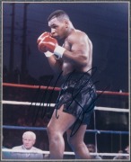MIKE TYSON: A timber display case comprising a signed photograph and "Everlast" glove, with plaque at base engraved "Iron - Mike Tyson"; two CoAs present; dimensions 74 x 57 x 17cm. - 2