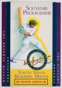 THE TOYOTA VIENTA V6 "BRADMAN" MATCH: A fully-signed souvenir programme with twenty-four original signatures, and a fully-signed bat, attractively framed and glazed, but with quite a few of the signatures faded; dimensions 108 x 33cm. (2 items) - 2