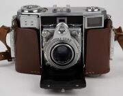 ZEISS IKON: Group comprising c. 1950 Contessa 533/24 (Tessar 45mm f2.8/Synchro Compur; with matching leather case), c. 1956 Contina 527/24 (Novicar-Anastigmat 45mm f2.8/Prontor-SVS), c. 1965 Contessa SLK (Tessar 50mm f2.8/Prontor SLK Spezial), and c. 1966 - 8
