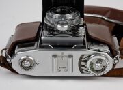 ZEISS IKON: Group comprising c. 1950 Contessa 533/24 (Tessar 45mm f2.8/Synchro Compur; with matching leather case), c. 1956 Contina 527/24 (Novicar-Anastigmat 45mm f2.8/Prontor-SVS), c. 1965 Contessa SLK (Tessar 50mm f2.8/Prontor SLK Spezial), and c. 1966 - 9