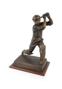 DON BRADMAN: Bronze statuette on timber plinth, dimensions approx. 53 x 36 x 25cm.