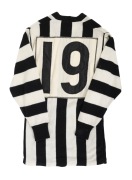 COLLINGWOOD: A late-1970s match-worn long-sleeved guernsey, VFL logo and "Yakka" patches on front, number 19 on back; John Wise, Laurie Sandilands, and Craig Davis wore this number during the seasons when this guernsey configuration was used.