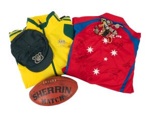A diverse group of sports items, comprising seven vintage whistles, 1969 "C.C.A. Fleming Shield" cricket cap, 2008 Gold Coast Indy 300 shirt with eight driver signatures on back, Adidas 2010 Delhi Commonwealth Games tracksuit jacket, and a Sherrin footbal