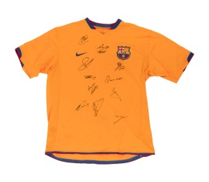 An FC Barcelona jersey signed to the front by eleven players, including Dani Alves; size XL.