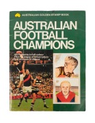 The Australian Golden Stamp Book of "Australian Football Champions" 1973, with the complete set of 48 stickers affixed in place. Interestingly, the players are drawn from the VFL (including Peter Hudson, Des Tuddenham, Peter Bedford and Kevin Sheedy), WAF