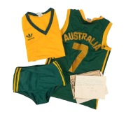 LOS ANGELES 1984 OLYMPIC GAMES - GREEN AND GOLD: One of heptathlon gold medallist Glynis Nunn's athletics uniforms (top and bottom, together with signed letter), together with one of Olympian Patricia Cockrem's basketball tops.