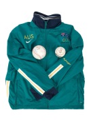 A group comprising a Nike Sydney 2000 Australia tracksuit top (size M), a Sydney 2000 softball with twenty signatures including those of Tanya Harding and Sally McCreedy, and a Sydney 2000 Mizuno 150 softball. (3 items)