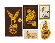 HAWTHORN FOOTBALL CLUB: A 1960s duffle-coat patch, a team tin badge, two different AMPOL stickers/decals, a 1970s Herald decal, and 1975 and 1976 Hawthorn Cheer Squad patches. (7 items).