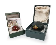 Australian Test Players Domestic International Season 2005/06 commemorative ceramic cricket ball, featuring sixteen facsimile signatures, including those of Shane Warne, Ricky Ponting, Adam Gilchrist, and Glenn McGrath; together with Cricket Australia cer