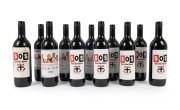 ST KILDA: A group of 1990s souvenir commemorative bottles of wine or port, most from the "Save Our Saints" campaign, one with eight original player signatures on the label, noted Nathan Burke. (11 items)