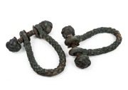 A pair of antique rope and leather maritime beckets with Turkmen knot decoration, 19th century, 21 x 16cm.