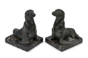 A pair of French Art Deco patinated spelter seal bookends on marble bases, signed "M. FONT", circa 1925, 13cm high.