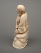 An antique Japanese carved marine ivory okimono of a seated figure, Meiji period, 19th/20th century, red seal two character mark to base, ​​​​​​​10.5cm high. - 4
