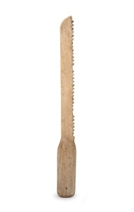 An antique carved whalebone breadknife, 19th century, 33cm long.