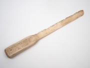 An antique carved whalebone breadknife, 19th century, ​​​​​​​33cm long. - 2