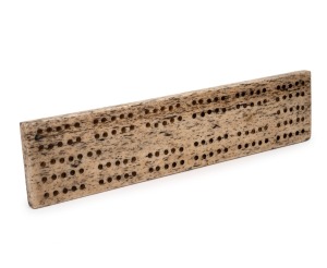 An antique carved whalebone cribbage board, 18th/19th century, 23cm long.