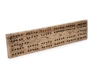 An antique carved whalebone cribbage board, 18th/19th century, ​​​​​​​23cm long.