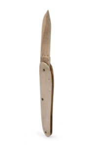 A sailor's antique pocketknife crafted from whale's tooth, 19th century, 13.5cm long when open.