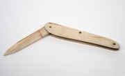 A sailor's antique pocketknife crafted from whale's tooth, 19th century, 13.5cm long when open. - 2
