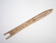 An antique whalebone sailor's netting tool, 19th century, ​​​​​​​28.5cm long. - 2