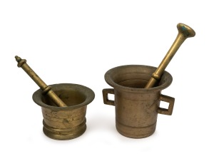 Two antique brass apothecary mortar and pestles 18th/19th century, the larger 12cm high.