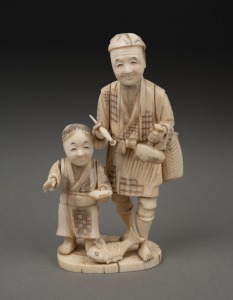 An antique Japanese carved ivory and bone okimono figural group, Meiji period, 19th/20th century, 16cm high.