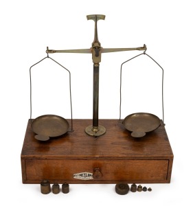 MEYLAN & Co. antique French balance scales on a timber single drawer base housing assorted brass weights, early 20th century, 33cm high, 30cm wide, 15cm deep.