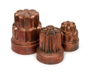 Three antique copper jelly moulds, 19th century, the largest 21cm high, 19cm diameter.