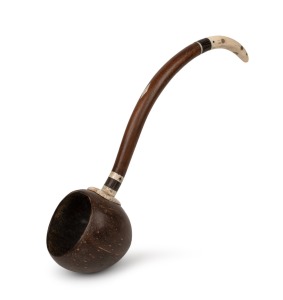 An antique maritime folk art dipping ladle, handsomely crafted from whalebone, coconut, hardwood and pearl shell, attractively finished with love heart decoration where the bowl and the shaft join, 19th century, 38cm long.