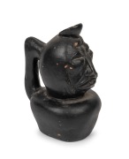 An antique pottery Moche jug with face decoration and black painted finish, Peruvian origin, 17cm high.