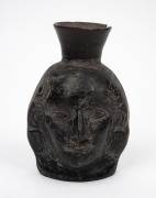 A pottery double sided face jug, Peruvian origin, 16cm high. - 2