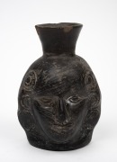 A pottery double sided face jug, Peruvian origin, 16cm high. - 3