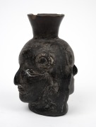 A pottery double sided face jug, Peruvian origin, 16cm high. - 4