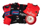 ESSENDON: A collection of 2020s club apparel comprising 1 jacket, 5 shirts, and 3 pairs of shorts (mostly AFL "On-Field" issues), together with a circa 1970s Essendon Bombers Courage Draught plastic beer tray and four 1960s "Essendon Club" membership pass