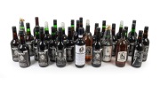 COLLINGWOOD: A collection of souvenir commemorative Copeland Trophy port bottles, spanning the years 1988 to 2011, together with seven other similar club bottles, two of which signed on the label by Jock McHale. (31 items)
