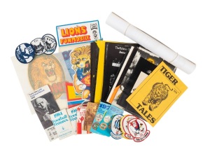 An accumulation of VFL/AFL ephemera, including twelve 1970s-80s official Richmond Tigers publications, five cloth badges (Geelong), four different 1975 Ampol "Team Mascot Car Stickers", a c. 1980s VFL "Lions Funmobile" paper hanging mobile (still in packa