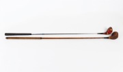 A circa 1970s left-handed Slazenger Bruce Devlin 4-wood golf club with steel shaft and persimmon head, together with a circa 1920s left-handed Spalding hickory-shafted brassie. (2 items) - 2