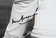 DON BRADMAN: Framed and glazed photograph of Bradman posed with bat, featuring Bradman's original signature in permanent marker; 60 x 50cm overall. - 2
