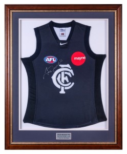 A CRAIG BRADLEY No.21 signed CARLTON Football Club guernsey (with Mayne branding logo at upper left); signed below the AFL logo, and accompanied by an Australian Sports Management Certificate of Authenticity. Attractively framed and glazed, overall 106 x 