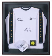 MARK PHILIPPOUSSIS: A Tennis Australia long-sleeved shirt, a "Yes OPTUS" peaked cap and a Slazenger tennis ball, all attractively box-framed with each item signed by Philippoussis; accompanied by a James Spence Authentication Certificate; overall 93 x 84 