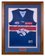 WESTERN BULLDOGS: "Season 2000 Official Team Signed Guernsey" display, featuring no fewer than twenty-eight original signatures, including those of Scott West, Adam Contessa, Nathan Eagleton, Nathan Brown, Rohan Smith, and others; attractively framed and 